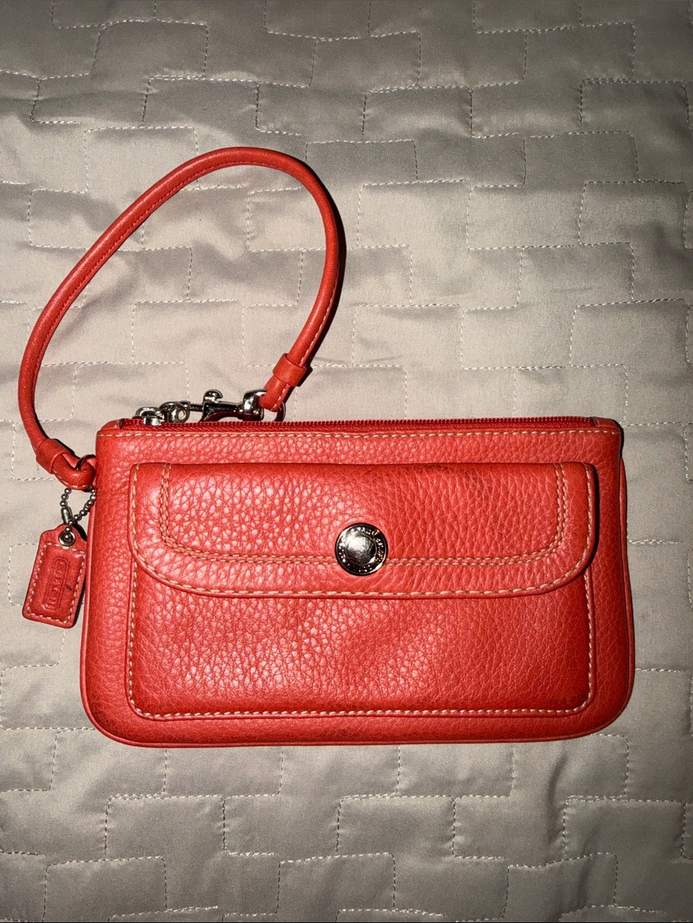 Coach Hamilton Pebbled Leather Flap Wristlet in Geranium Coral